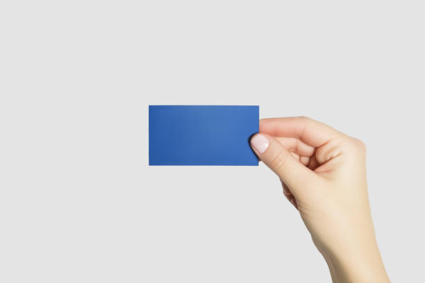 istock hand holding blue business card isolated on gray background 2149565476