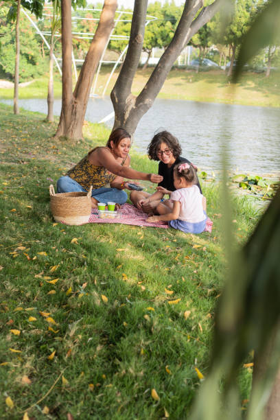 istock Family Enjoying Lakeside Picnic 2149568029