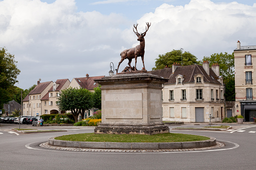 Senlis, France - July 19 2017: Bronze statue of a deer, place du Chalet, northeast of downtown. The statue was made in 1877 by sculptor Pierre Louis Rouillard.