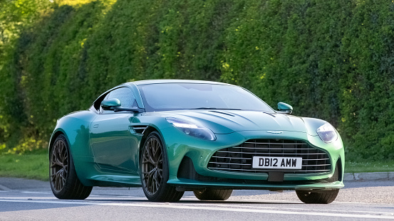 Bicester,UK- Apr 21st 2024: 2023 green Aston Martin DB2 V8 classic car driving on a British road