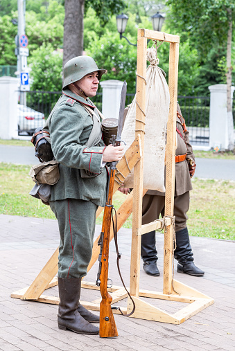 Samara, Russia - May 27, 2023: Unidentified member of Historical reenactment in soldier of German Army uniform of First World War 1914 - 1918 with rifle