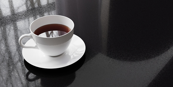 A cup of tea on black granite background