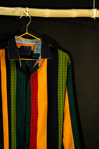 Casual Shirt With Colorful Strips Hanging On Display