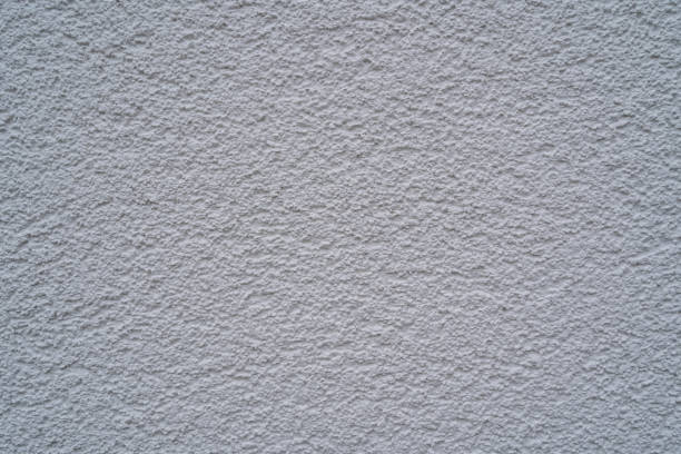 Facade of a house with white rough plaster