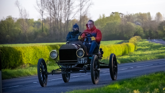 Bicester,UK- Apr 21st2024: Proud owners out for a drive in their 1914 Model T Ford car on the 2024 annual Drive It Day when enthusiasts drive their classic and vintage cars