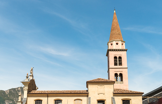 View of the bell tower of church of San Carpoforo in Bissone, district of Lugano, Ticino, Switzerland.
