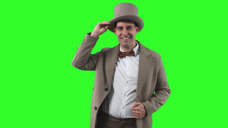 vertical Vintage Man in Bowler Hat and Trench Coat Saluting with Reverence chroma green screen