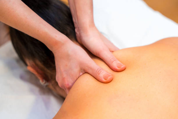 istock Masseuse giving a cervical massage to a patient 2149581850