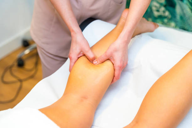 istock Masseur giving a leg massage at woman 2149582005