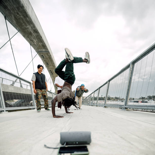 Guys practicing breakdance in the street