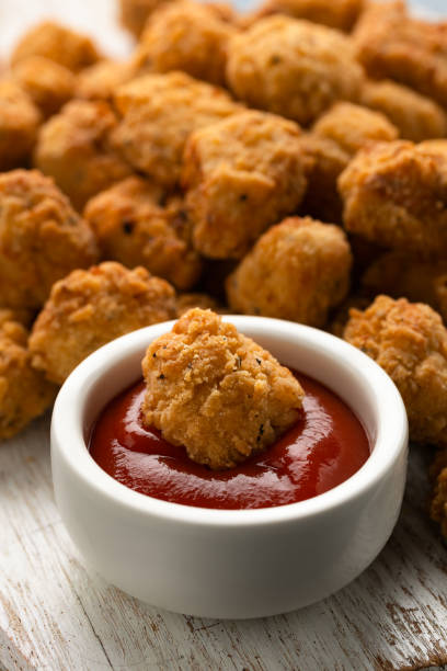 istock Crispy Popcorn Chicken with ketchup sauce on white wooden board 2149582368
