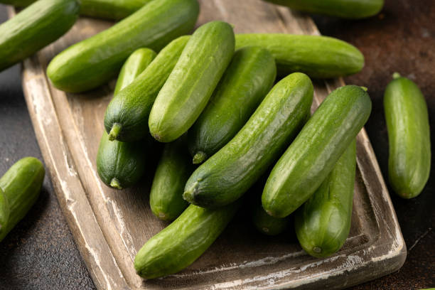 istock Raw Organic Mini Baby Cucumbers on wooden board. Ready to Eat 2149582521