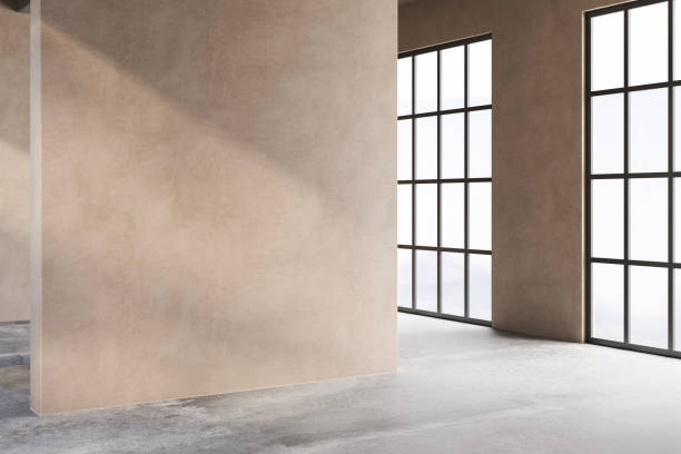 istock A room with a tan wall and a black window. The room is empty and has a very simple design 2149584163