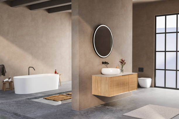 istock A bathroom with a white bathtub and a sink with a mirror above it 2149584228
