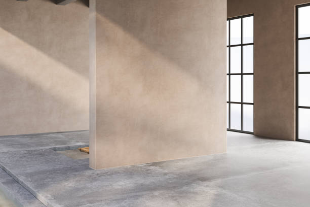 istock A large room with a wall and a window. The room is empty and has a very clean and simple design 2149584229