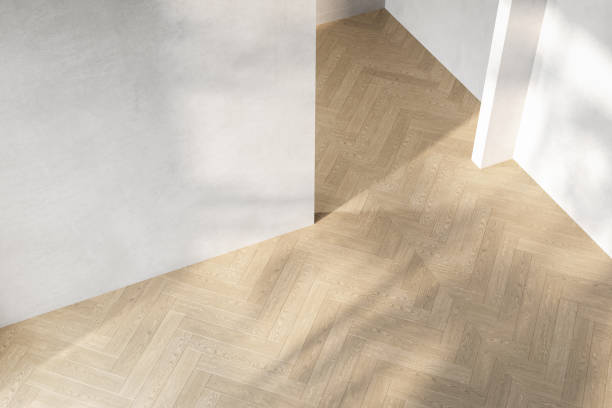 istock A room with a white wall and a wooden floor with a shadow on it 2149584871