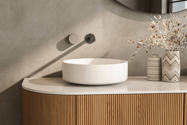 istock A white sink sits on a wooden countertop in a bathroom 2149584895