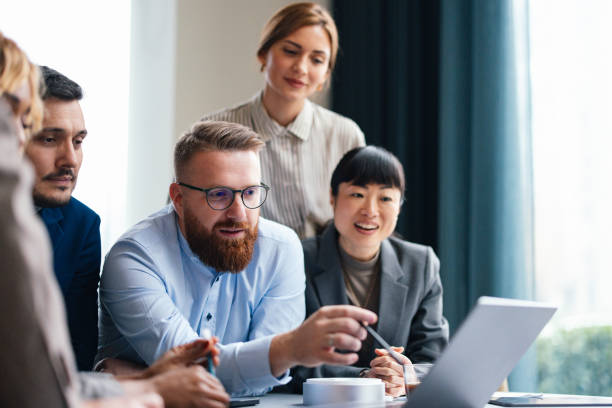 istock Happy Business People Working On A Computer In The Office 2149585765