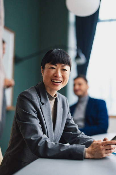 istock A Happy Beautiful Businesswoman Looking At Camera While Working In The Office 2149585771