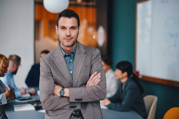 istock A Happy Handsome Businessman Looking At Camera While Keeping His Arms Crossed 2149585791