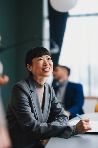istock A Happy Beautiful Businessman Looking Away While Working In The Office 2149585792