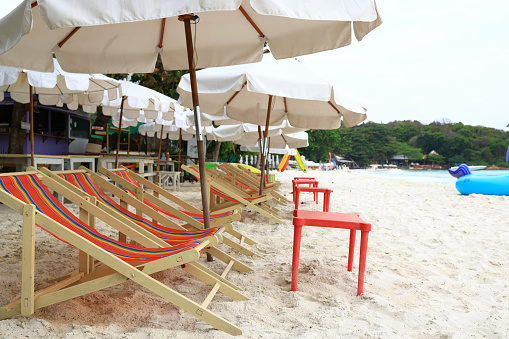 Sun chair and umbrella on a tropical beach