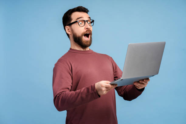 istock Portrait of excited man using laptop, high speed internet, connection isolated 2149588976