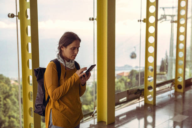istock Eco friendly transport. Woman checking timetable. 2149591267