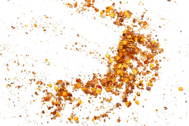 istock dried red chili pepper flakes and seeds isolated on white background 2149591368