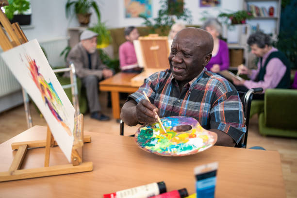 istock Assisted living residents during an art and craft activity 2149593592