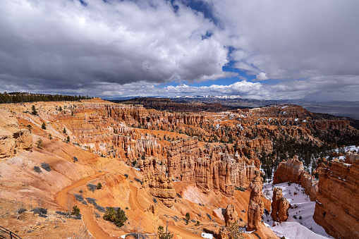 Snow clouds hover over Bryce Canyon's hoodoos to start off the month of April