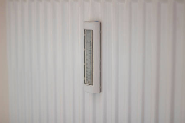 Close-up of industrial thermometer.