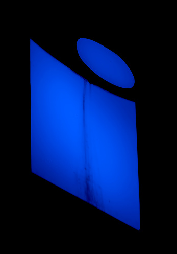 Radiant 'i' letter in electric blue, its simplicity a profound statement in the silence of night