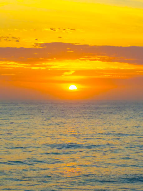 istock Hazy Summer Sunrise at the seaside with high cloud 2149602832