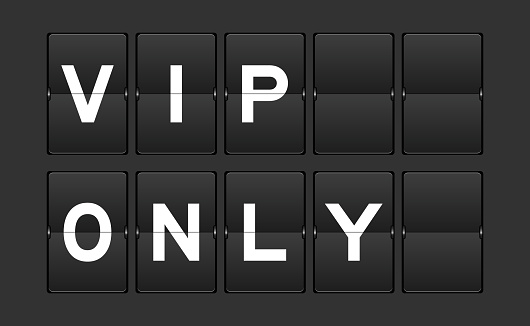 Black color analog flip board with word VIP (abbreviation of very important person) only on gray background