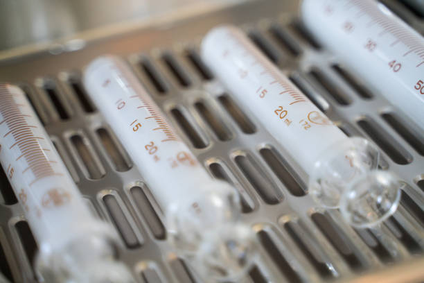 Glass syringes lined up in a tray