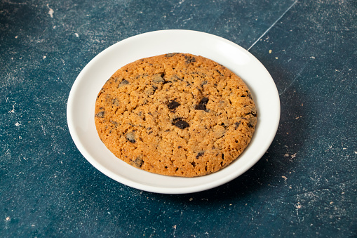 Chocolate Chips Cookies served in plate isolated on background side view of cafe baked food