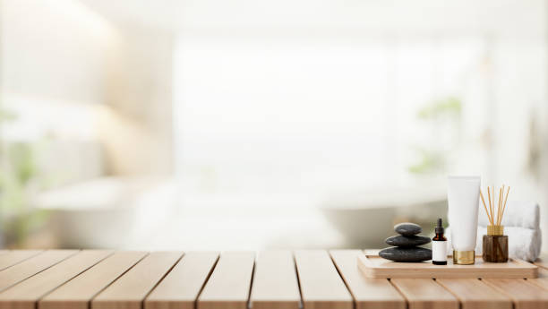 istock A spa shower set on a wooden table with a blurred background of a contemporary spacious bathroom. 2149605528