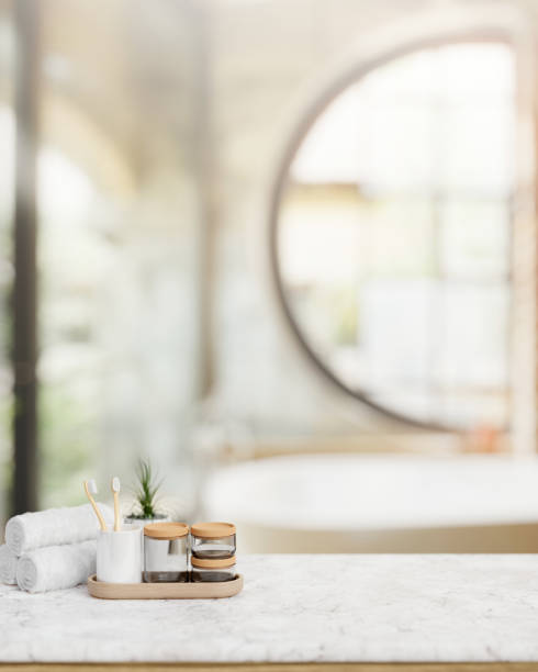 istock Bath accessories on a luxury white marble tabletop in contemporary luxurious bathroom with a bathtub 2149605603