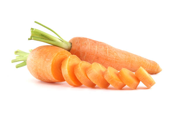 istock Whole carrot alongside its sliced pieces over white background 2149607036
