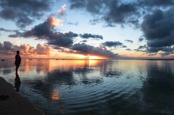 istock Silhouette of person watching tropical sunset 2149608207