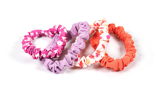 Colourful hair scrunchies on white background.