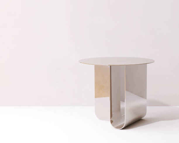 istock Modern design of gold chrome round podium table in sunlight, shadow on wall 2149609530