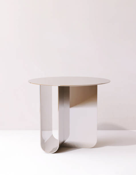 istock Modern design of gold chrome round podium table on white floor in sunlight, shadow on wall 2149609537