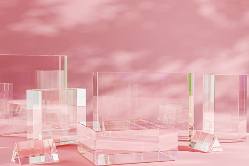 product placement podium. transparent display stands of varying heights grace pink backdrop, clarity perfect for accentuating any product, from perfumes to tech gadgets, under soft, ambient lighting