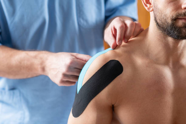 istock Elastic therapeutic tape application on the shoulder for support and rehabilitation. 2149613415