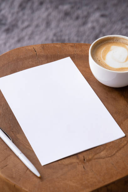 istock blank notepaper mockup on coffee table with cappuccino, pen and grey rug 2149613693