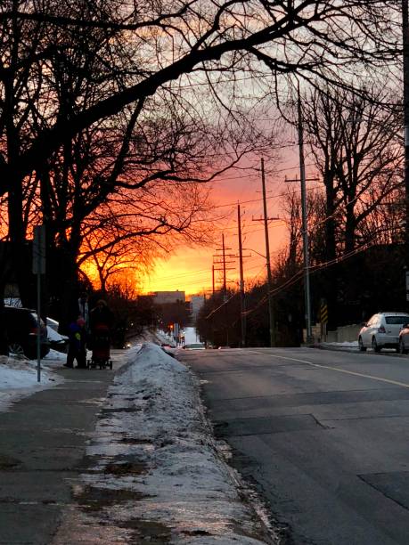istock Sunrise over Winter Snowy Street 2149613707