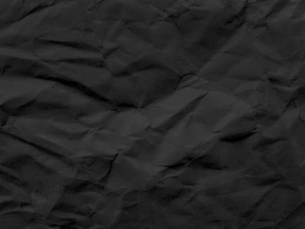 istock black wrinkled paper texture. crumpled paper 2149614142