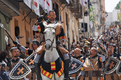 Alcoy, Spain, 04-20-2024: Squadron of the Aragoneses troupe with its corporal in front in the Moors and Christians parade of Alcoy, a festival of international tourist interest since 1980